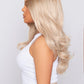 synthetic long wavy blonde hair wig on model