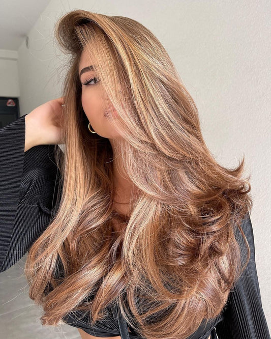 Gorgeous lady with vanilla highlights on brown base spring hair color