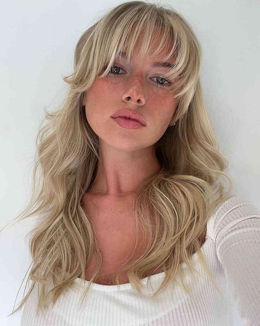 woman wearing blonde long layers fringe