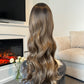 Back view of a 24-inch wavy balayage wig, emphasizing the soft waves and natural color gradient