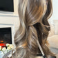 Close-up of a synthetic bronde wig featuring a natural balayage effect and a lace front