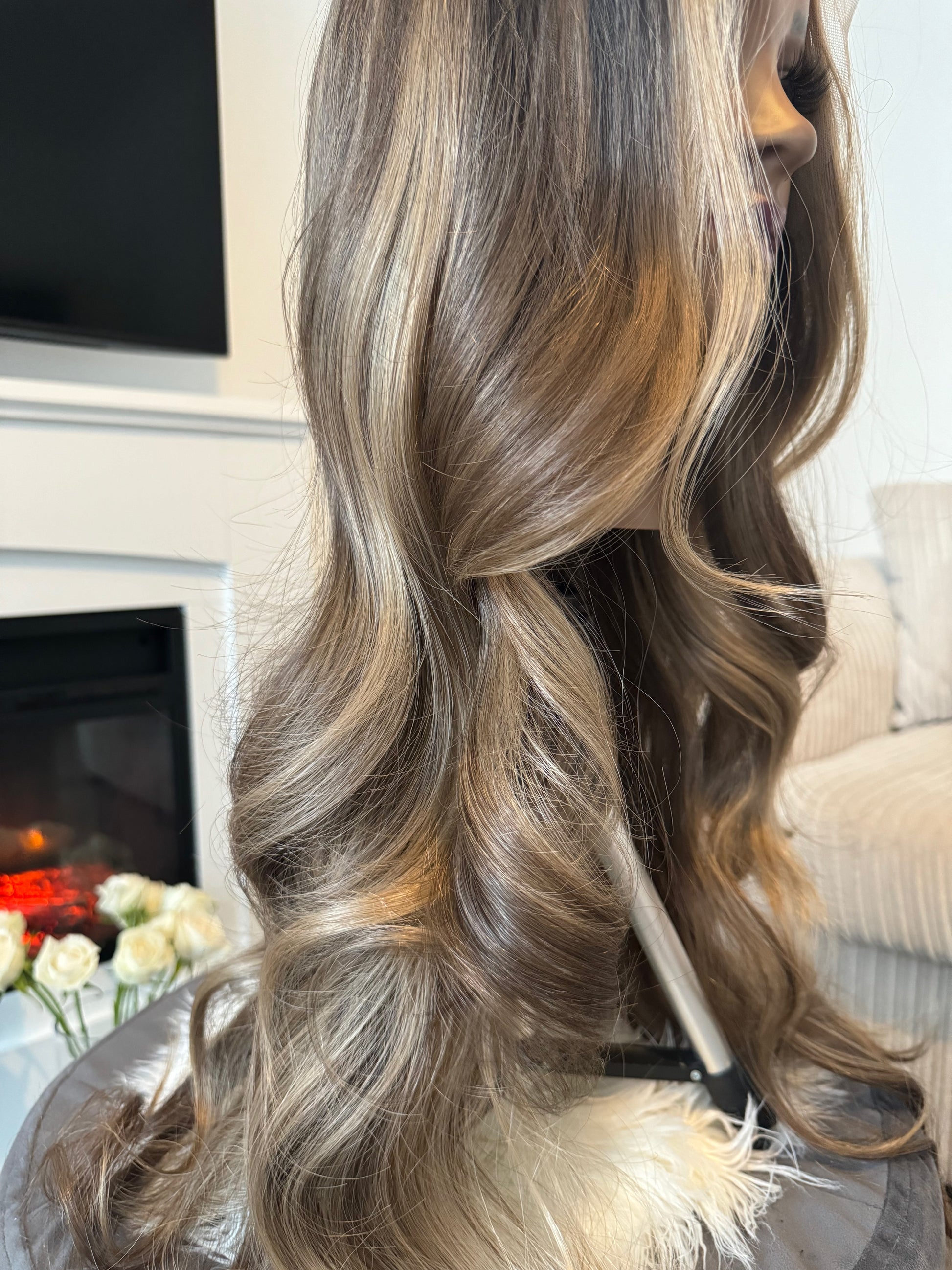 Close-up of a synthetic bronde wig featuring a natural balayage effect and a lace front