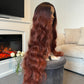 product Side view of an auburn wavy wig with a lace front, highlighting the natural-looking waves and length