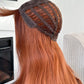 Lightweight and breathable synthetic wig in bold ginger tones.