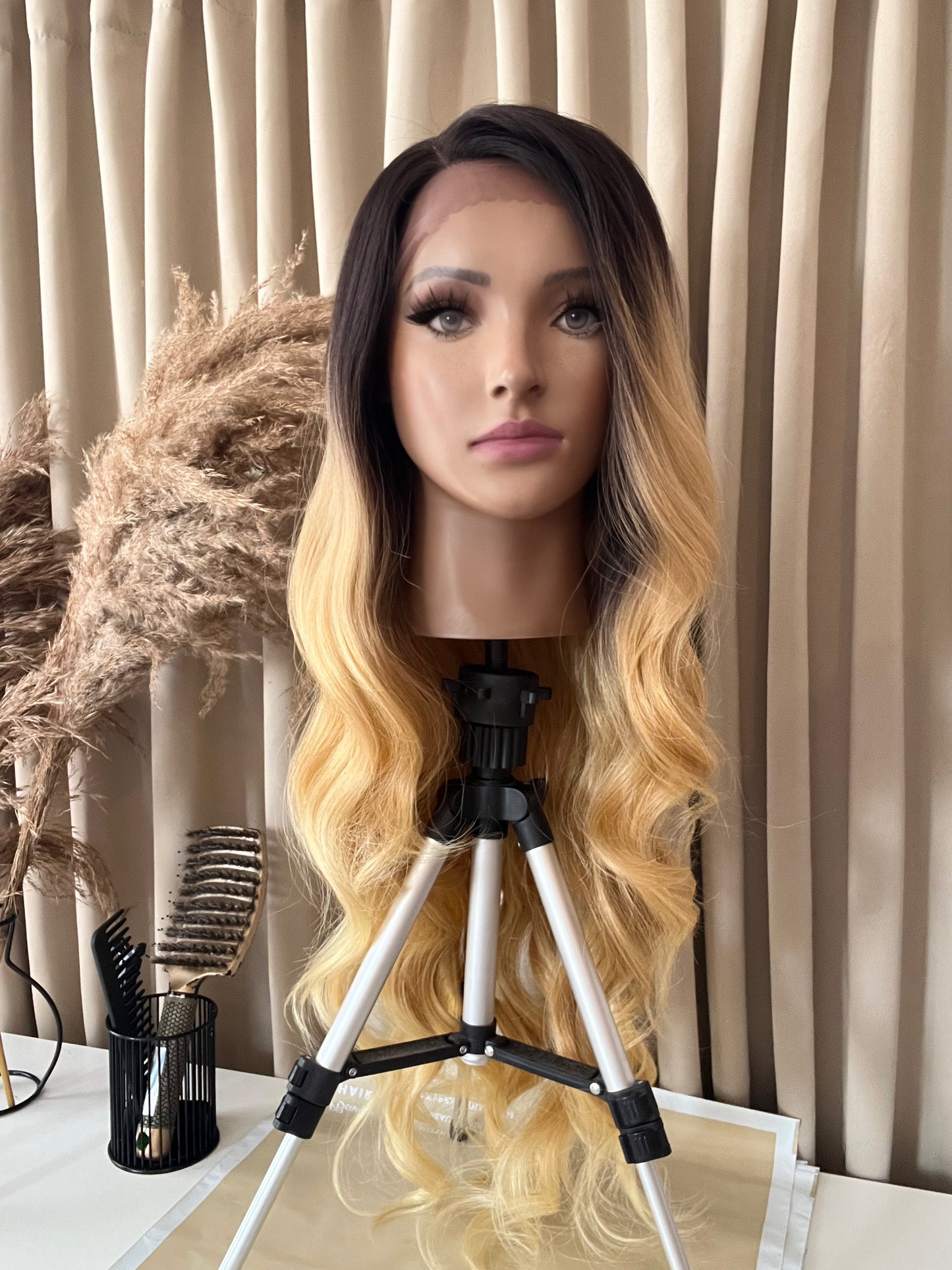 blonde synthetic hair wig on mannequin