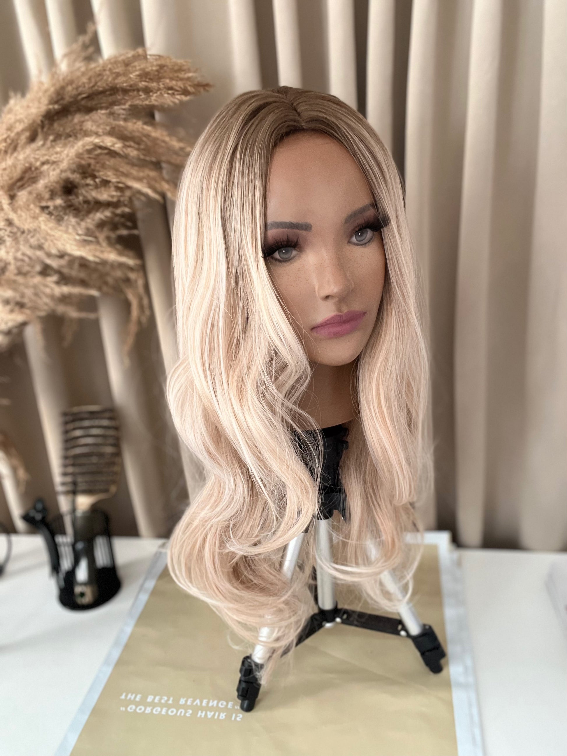beautiful blonde ombre synthetic hair wig on mannequin head