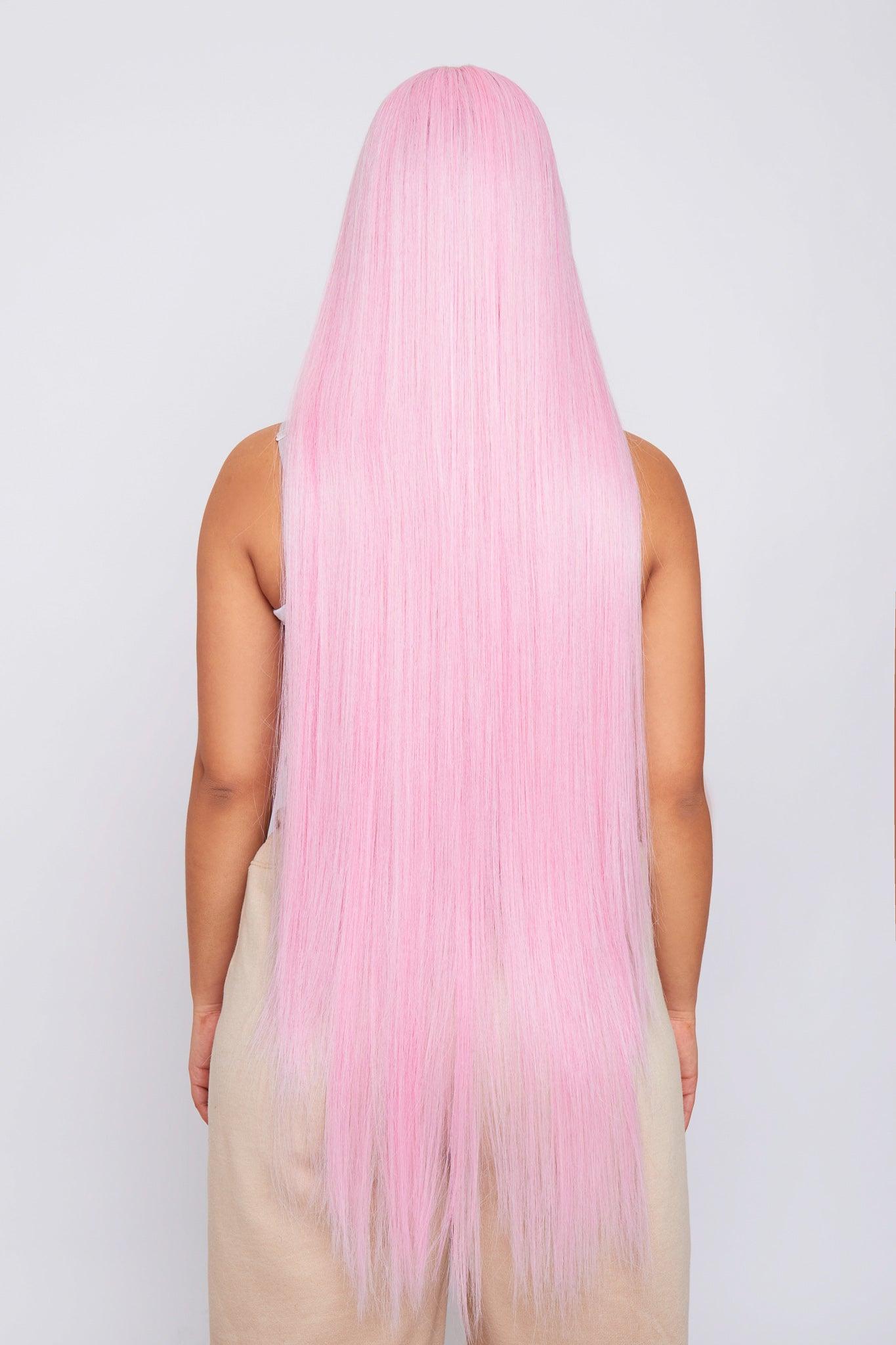 long straight pink synthetic hair wig on model