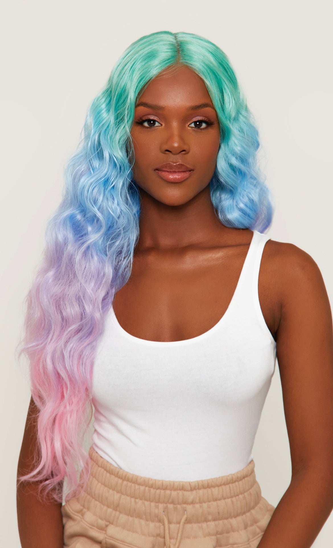 black girl wearing rainbow long wavy hair wig