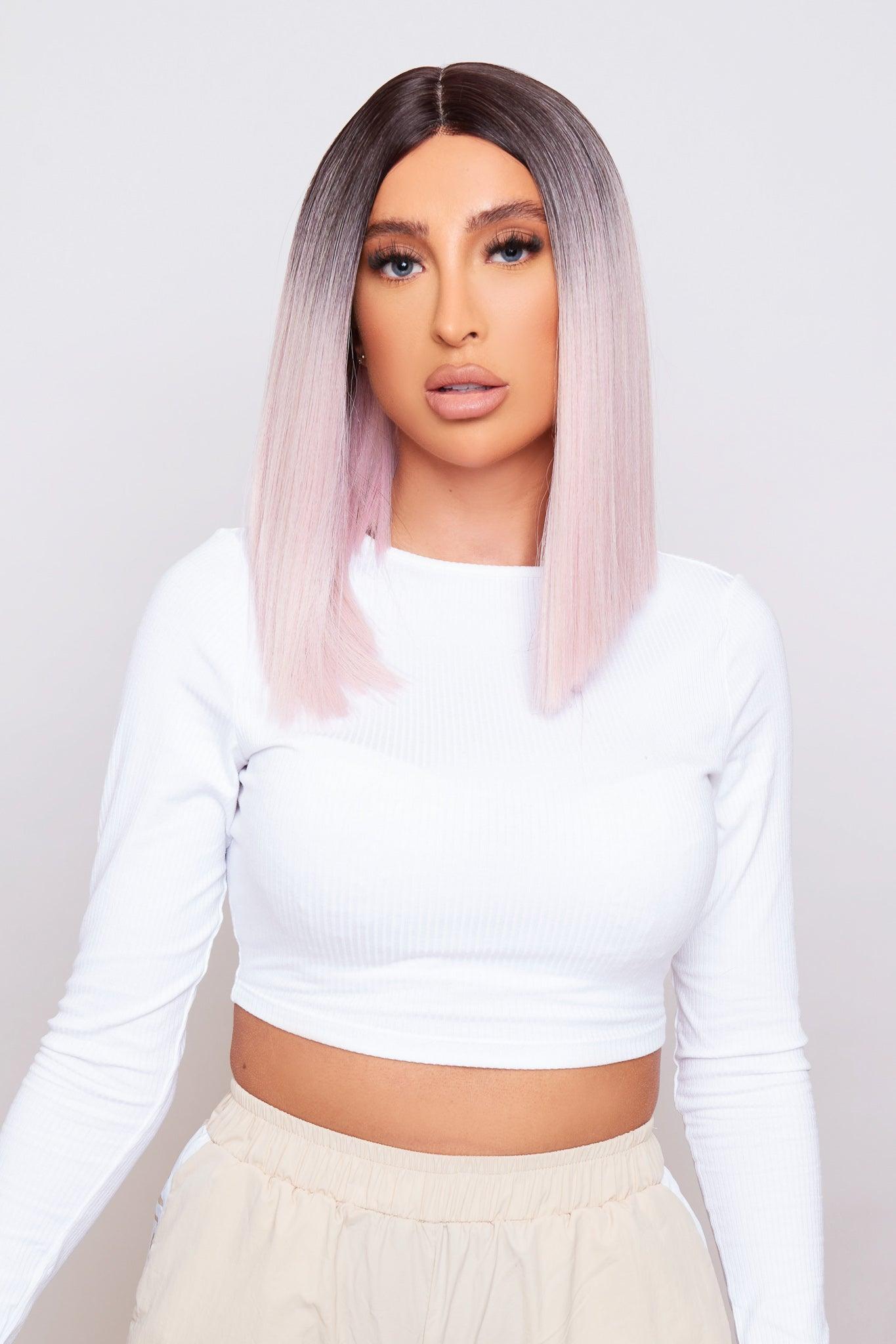 pink blunt cut bob wig being worn by beautiful model