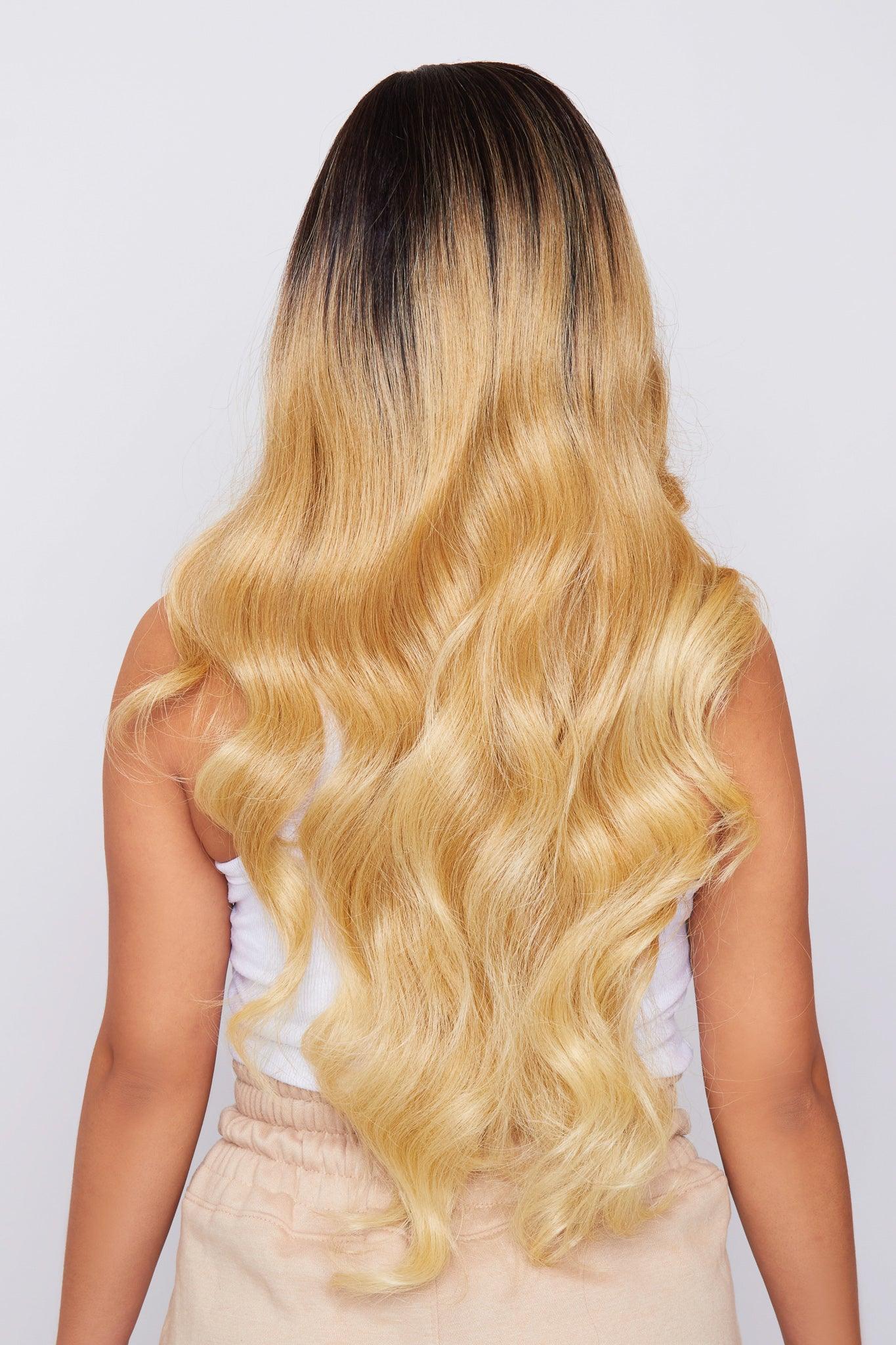beautiful ombre blonde long wavy wig being worn by model from hair brand pbeauty hair