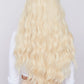 bleach blonde wig long and wavy being worn by girl form hair company pbeauty hair