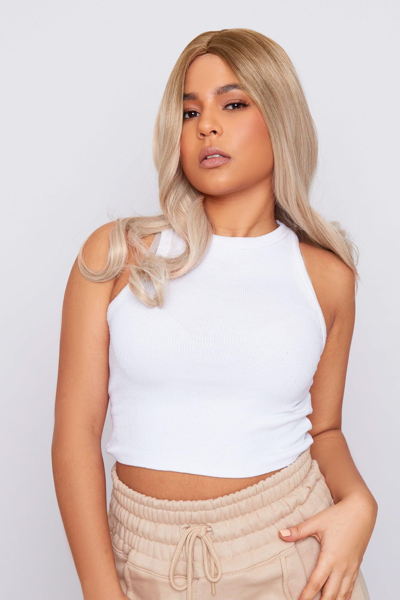 mixed race girl in natural blonde non lace synthetic hair wig wearing white top